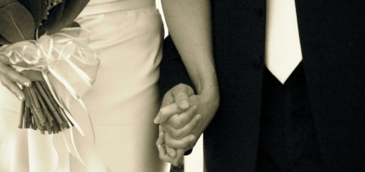 Couple on their wedding day holding hands