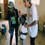Children in Belize receiving an eye exam