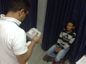 Child receiving eye exam in Bogota, Colombia