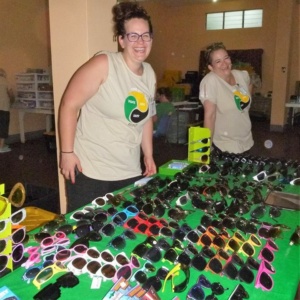 Associates giving out sunglasses in Jamaica