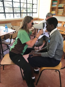 Young man getting an eye exam in Kenya