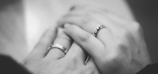 Two hands with wedding rings
