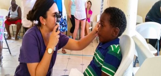 Child receiving an eye exam in Belize